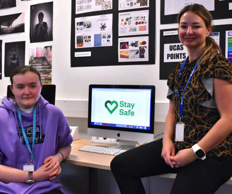 Keira Todd, Digital Art student, working on her Stay Safe logo in The Arts Academy at Bede Campus. with lecturer Lisa McLellan.